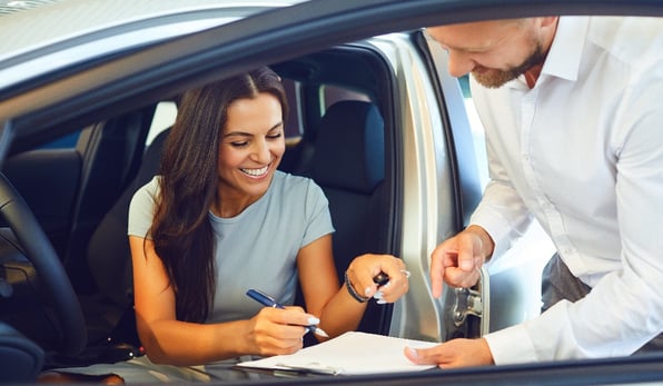 Woman buying new car