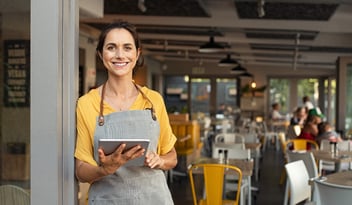 Business owner in front of store